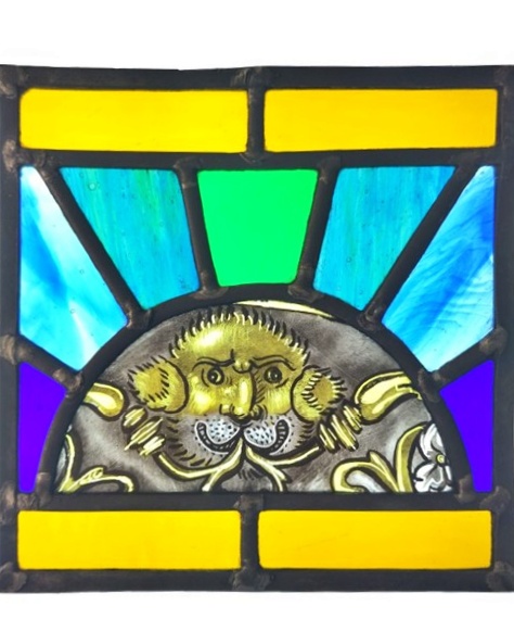 A panel with a small medieval style lion in the centre, surrounded by geometric shapes.